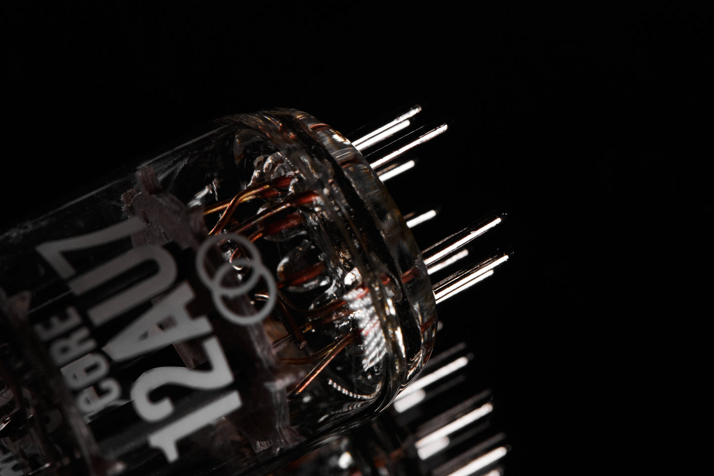 Close-up of a mechanical component with visible branding on a black background