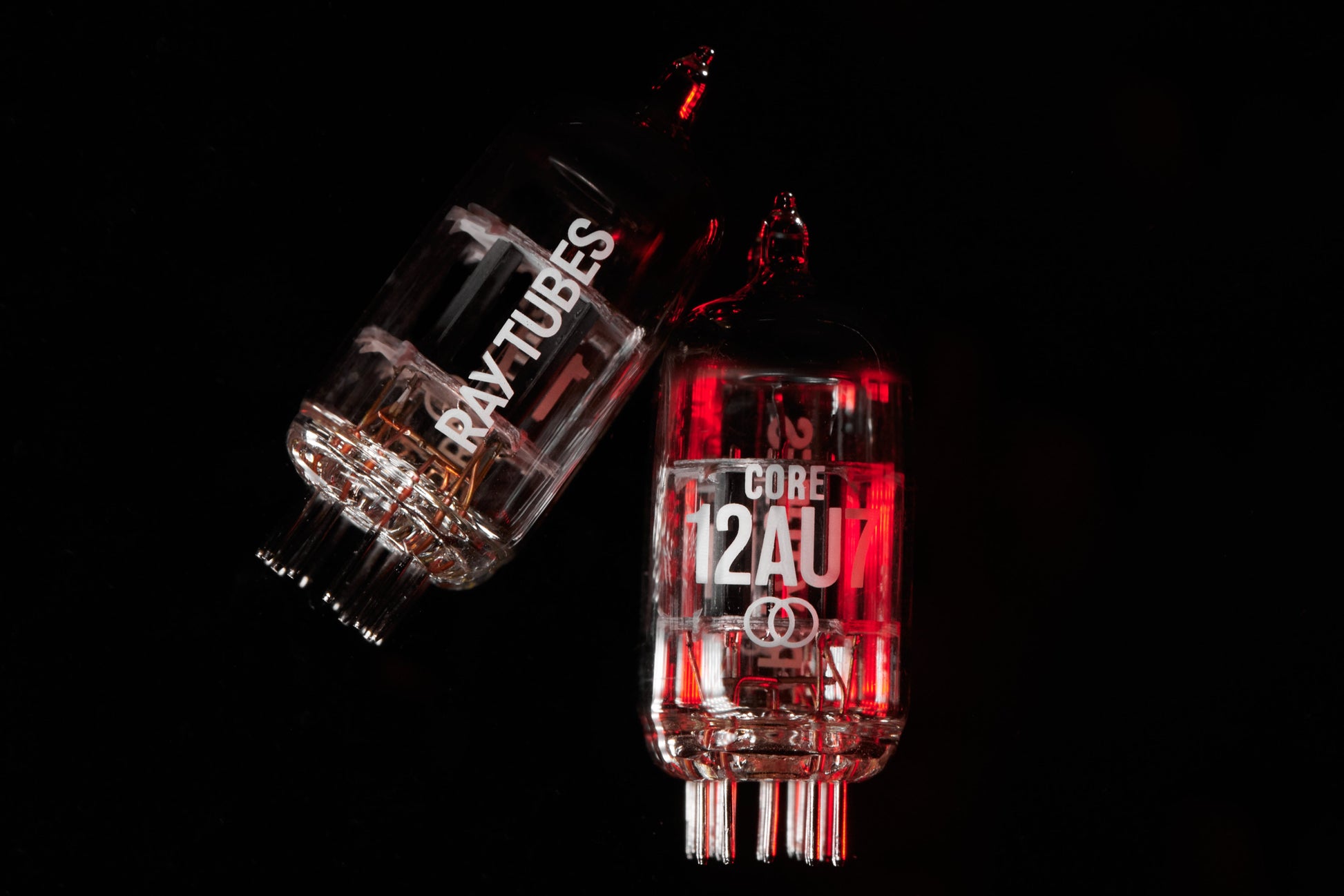 Two glass tubes labeled 'Ray Tubes' and 'CORE 12AU' on a black background