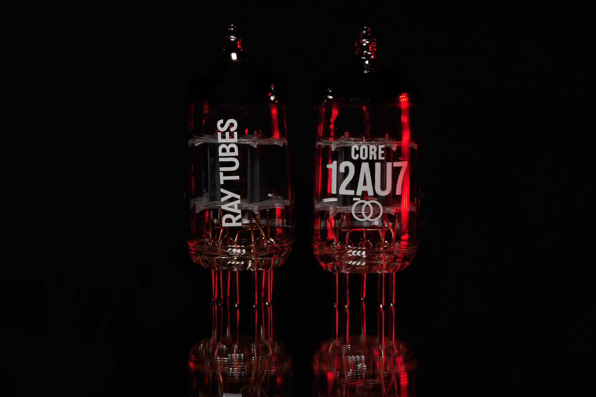 Two electronic tubes with 'RAY TUBES' and 'CORE 12AU7' branding on a black background.