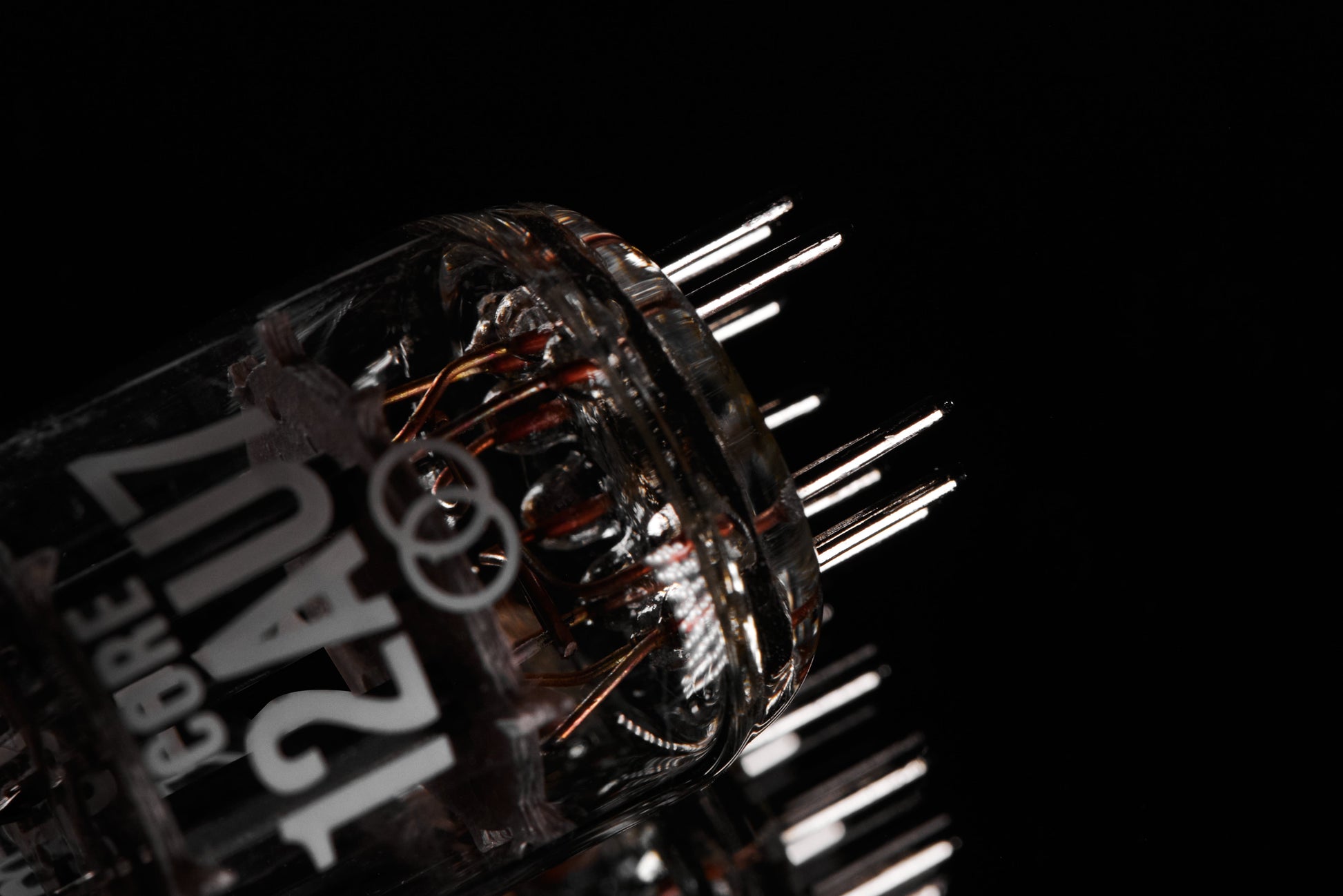 Close-up of a mechanical component with visible branding on a black background