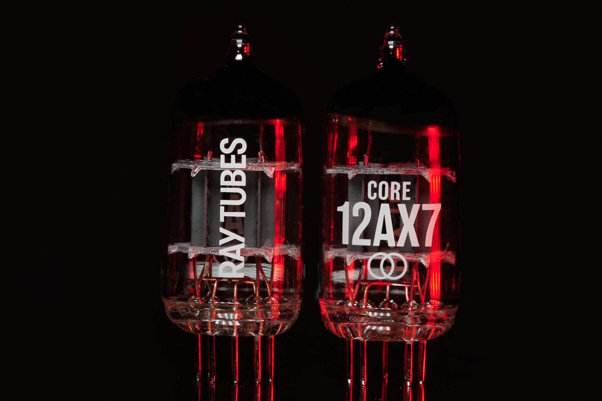 Two vacuum tubes with 'RAY TUBES' and 'CORE 12AX7' branding on a black background.