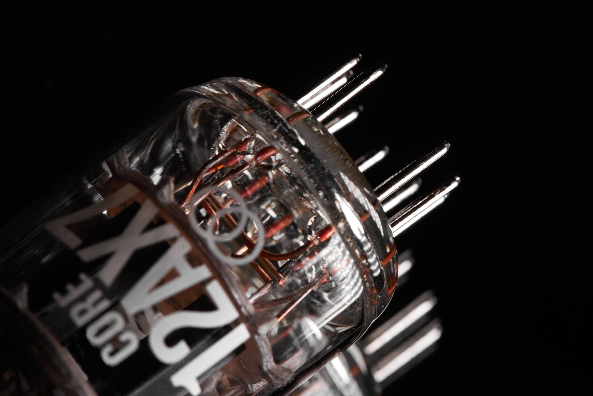 Close-up of a metallic component with 'Rapoo' branding on a black background