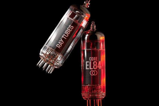 Two vacuum tubes with 'Ray Tubes' and 'CORE EL84' branding on a black background.