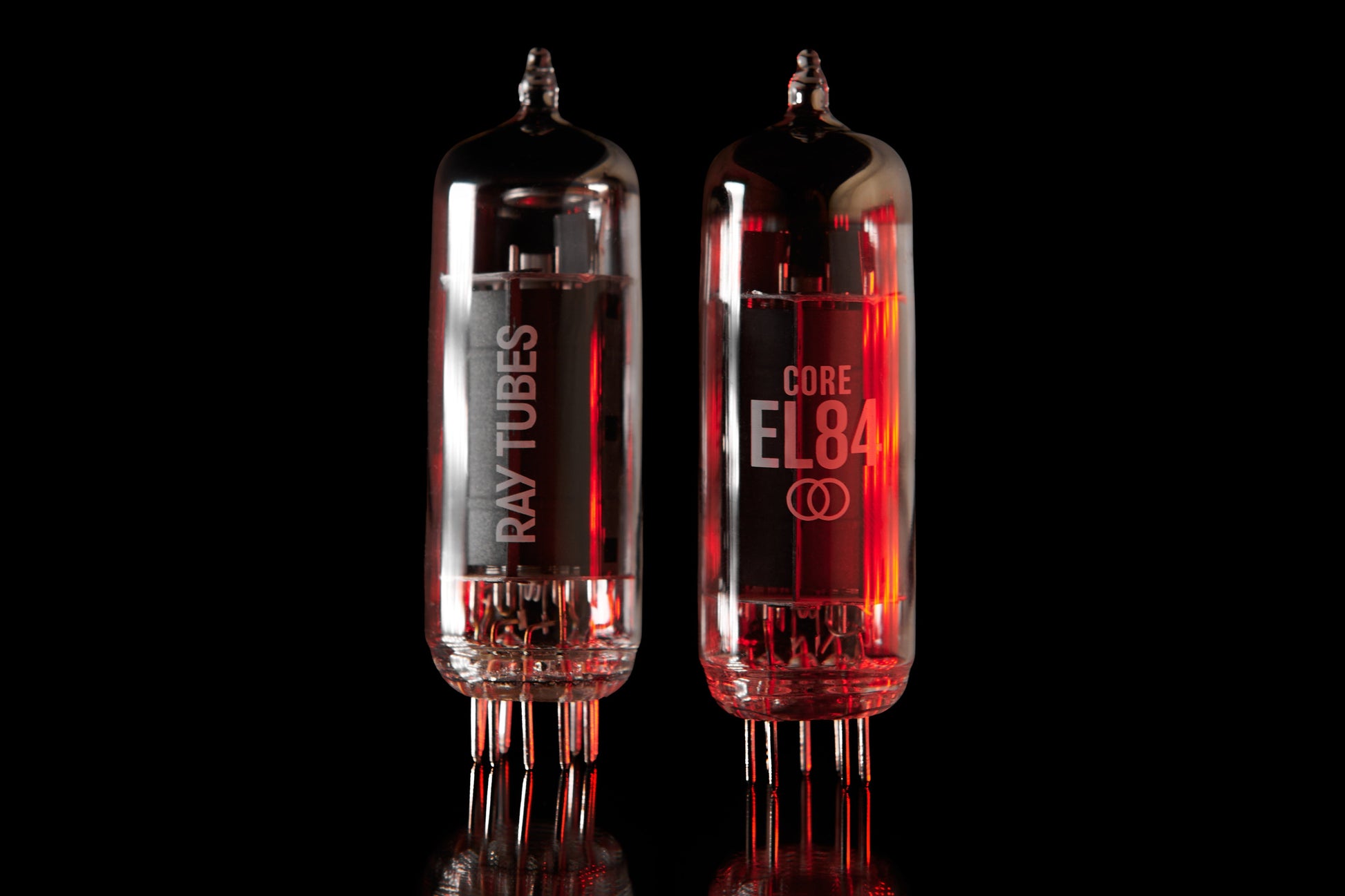 Two vacuum tubes with 'Ray Tubes' and 'CORE EL84' branding on a black background