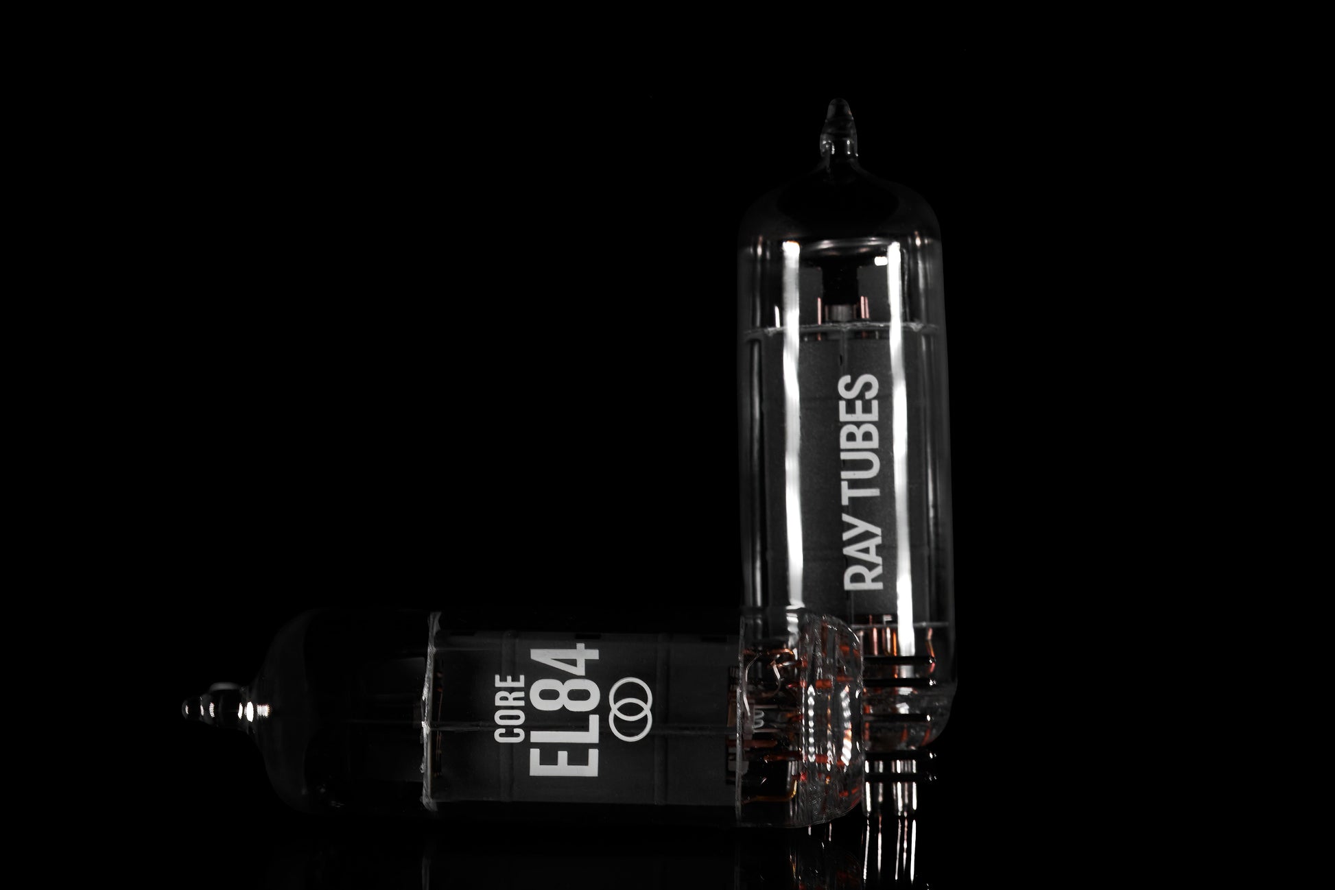 Two Ray Tubes vacuum tubes on a black background