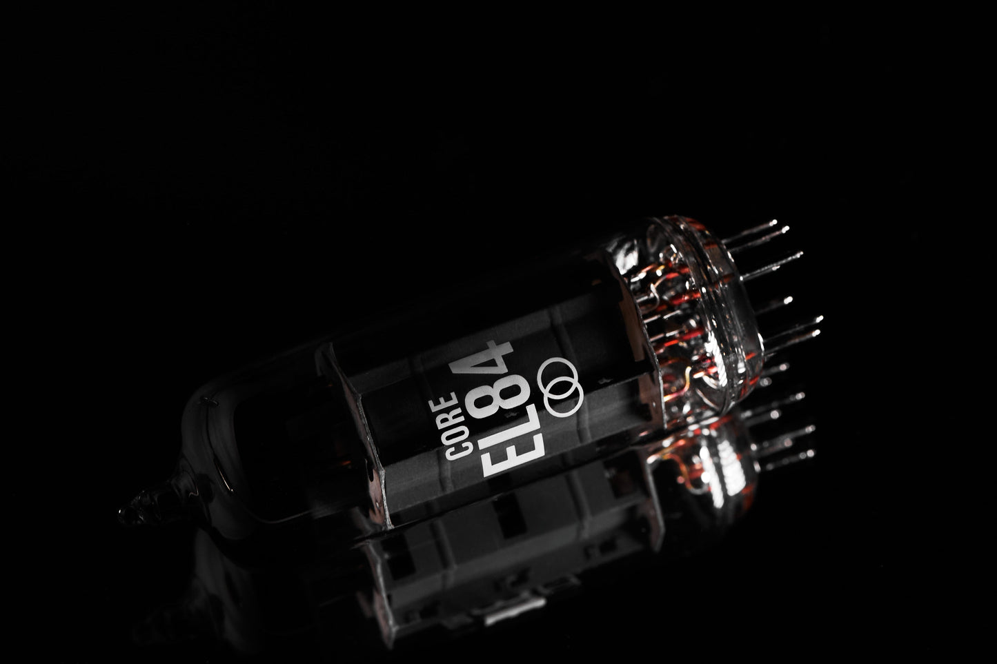 Electron tube with 'CORE EL84' marking on a black background