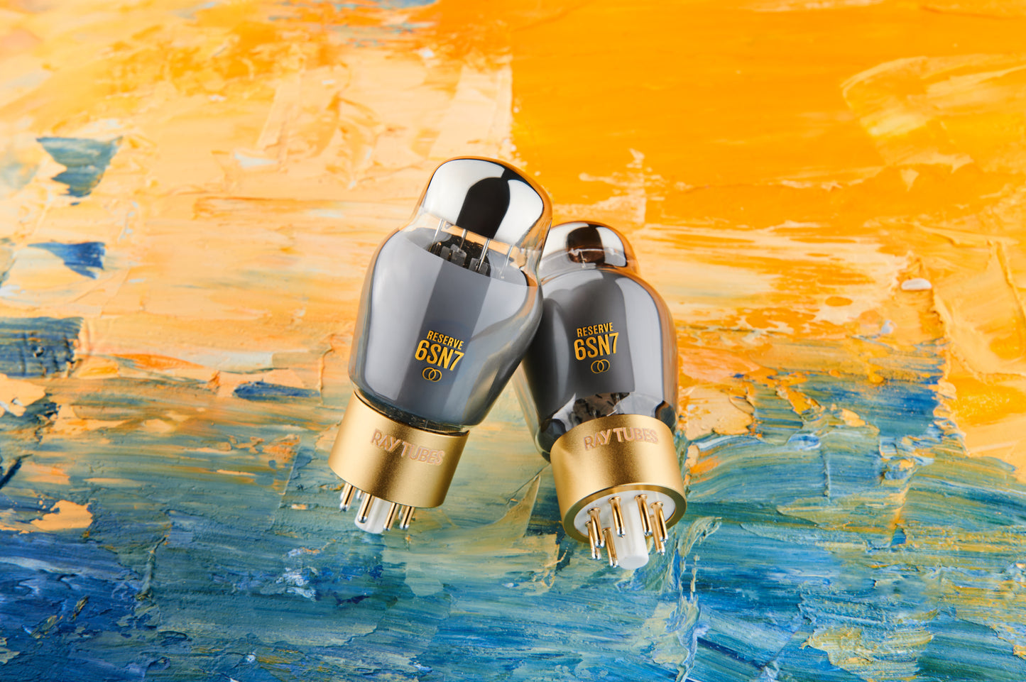 Two vacuum tubes with '6SN7' branding on an abstract blue and orange background