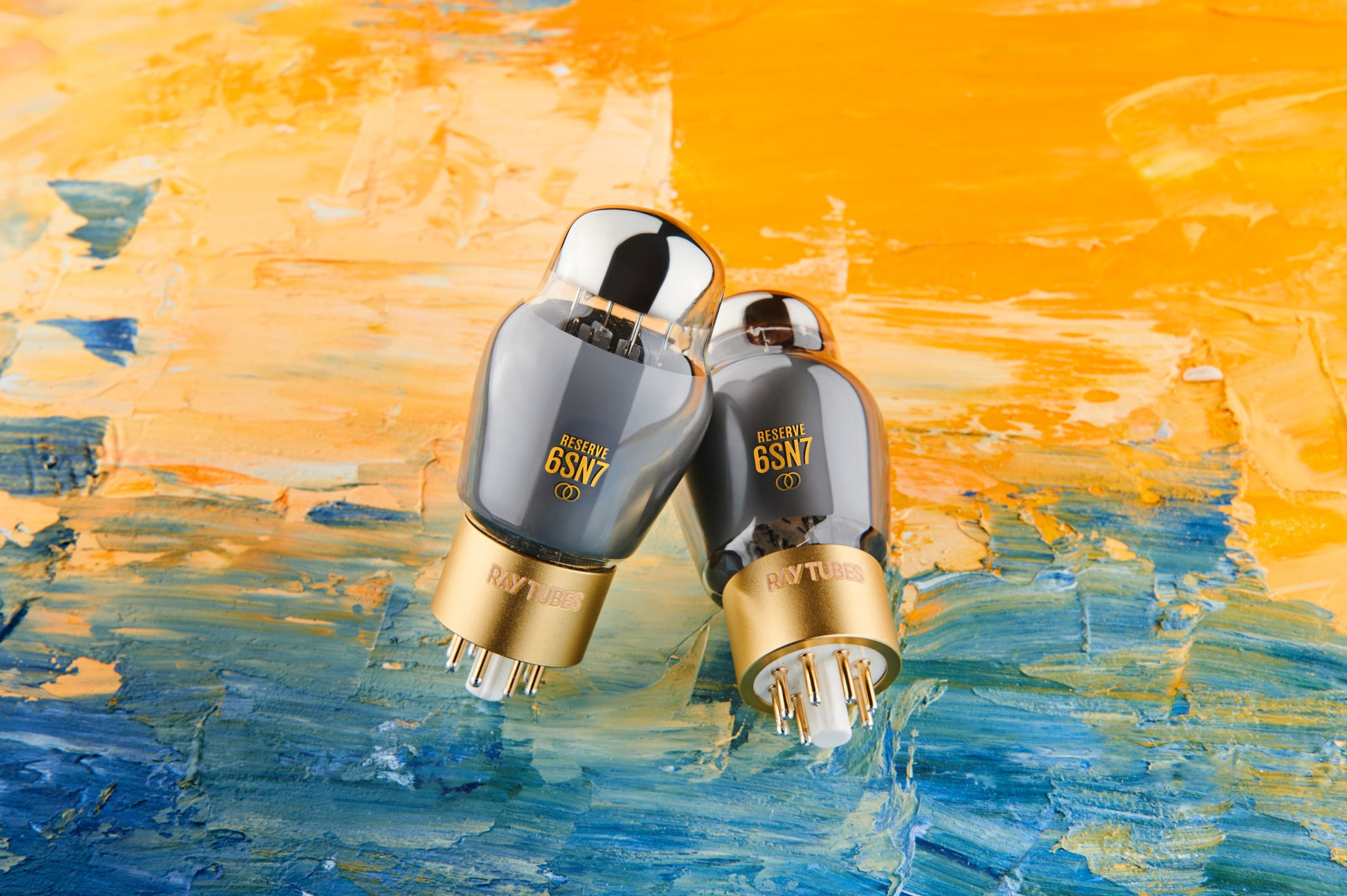 Two vacuum tubes with '6SN7' branding on an abstract blue and orange background