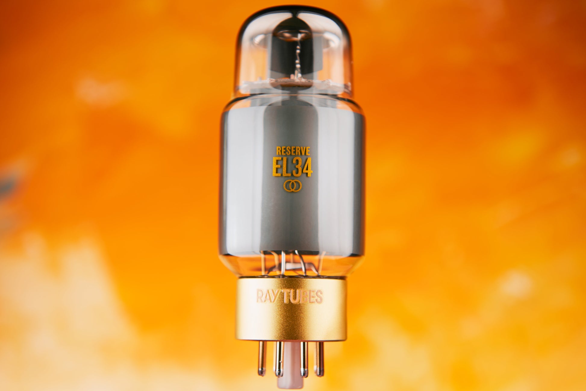 Vacuum tube with 'RESERVE EL84' marking on an orange background