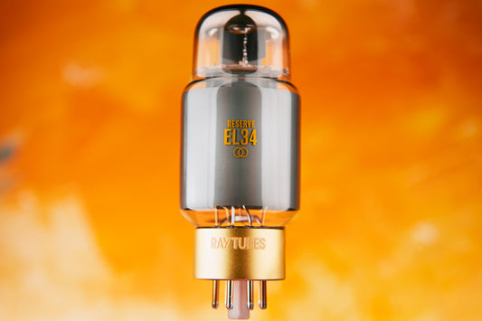 Vacuum tube with 'RESERVE EL84' marking on an orange background