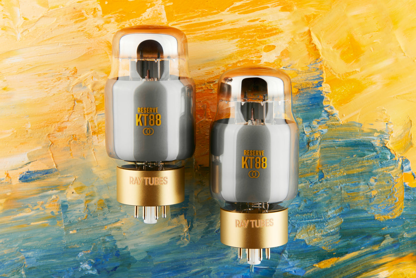 Two vacuum tubes with 'RESERVE KT88' marking on a colorful abstract background