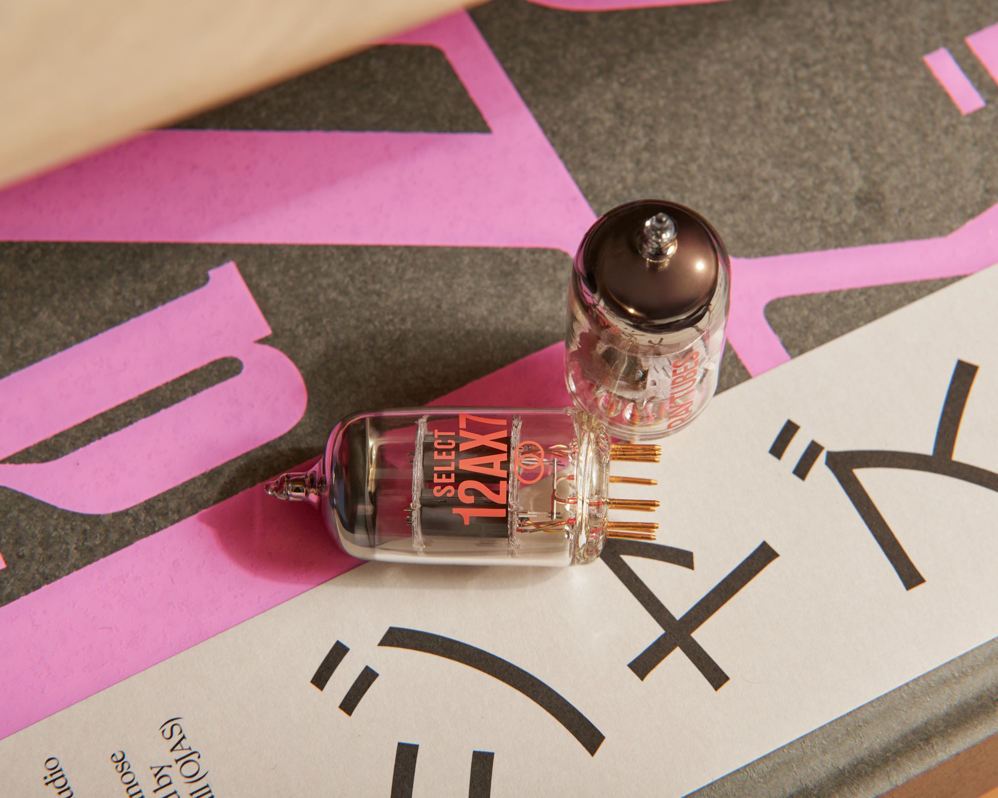 Vacuum tube on a graphic background with text
