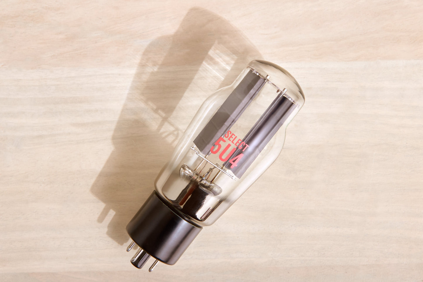 Vacuum tube with 'SELECT 5U4' branding on a wooden surface