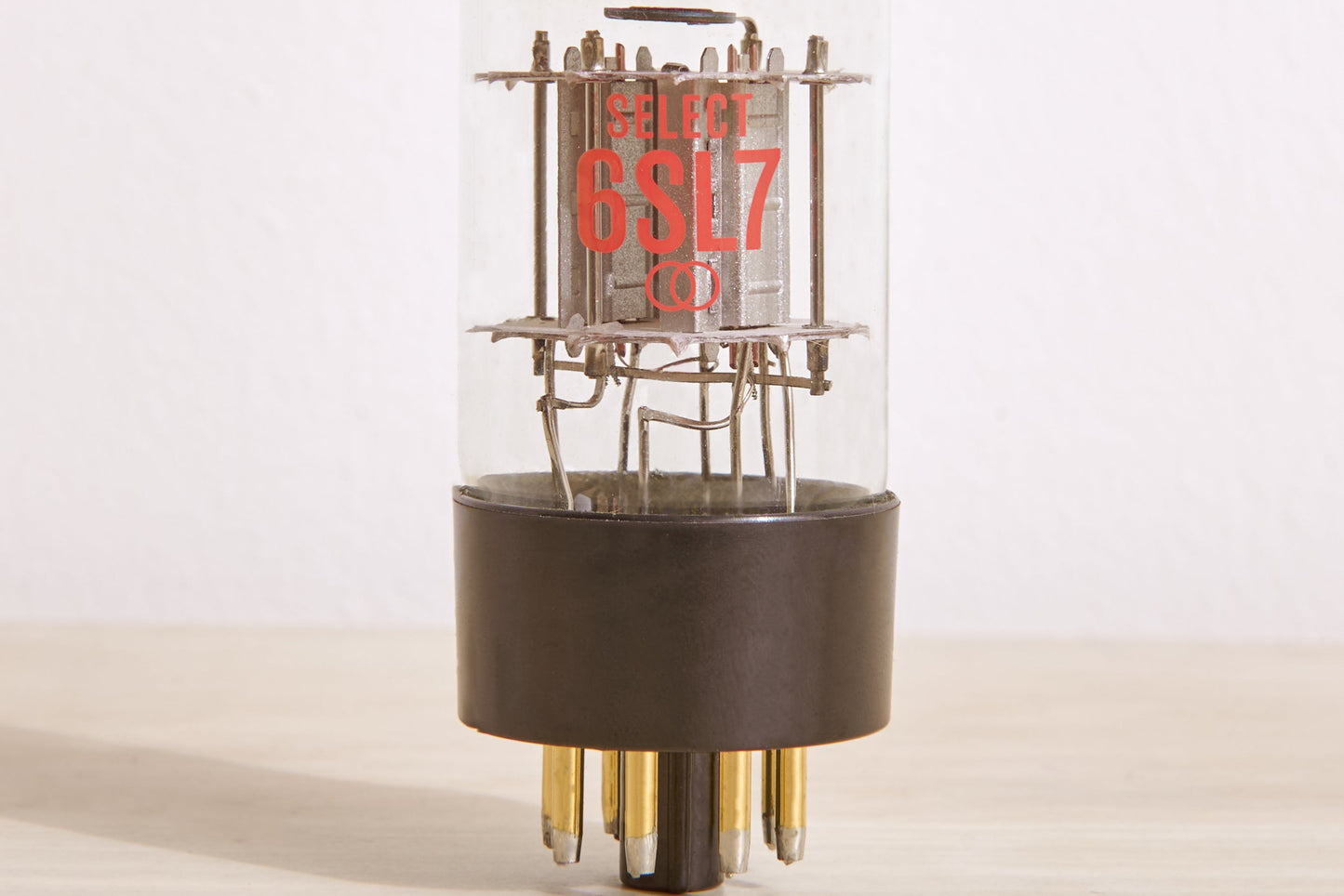 Vacuum tube with 'SELECT 6SL7' branding on a light background