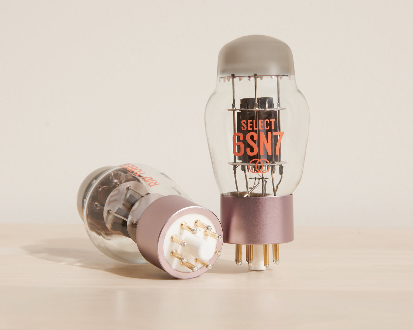 Two vacuum tubes with 'SELECT 6SN7' branding on a beige background