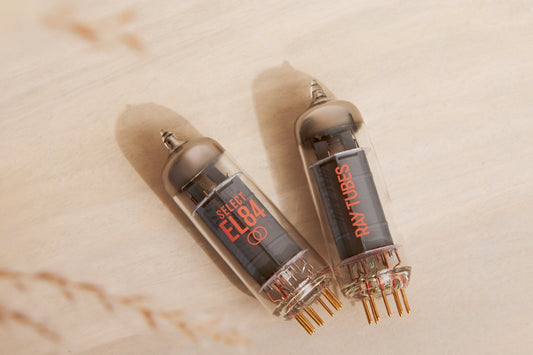 Two vacuum tubes with 'SELECT EL84' and 'Ray Tubes' markings on a beige background