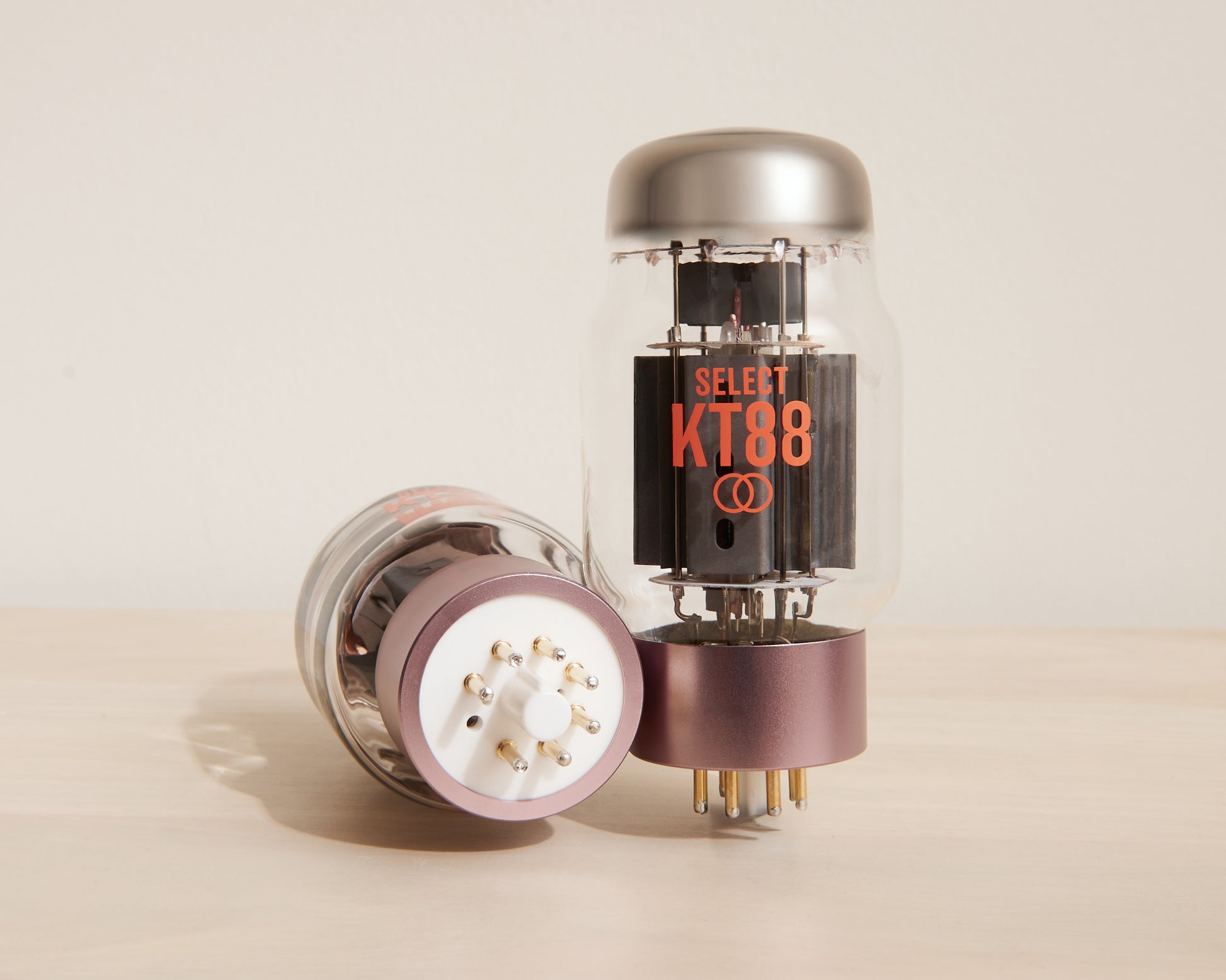 Vacuum tube with 'SELECT KT88' branding on a beige background