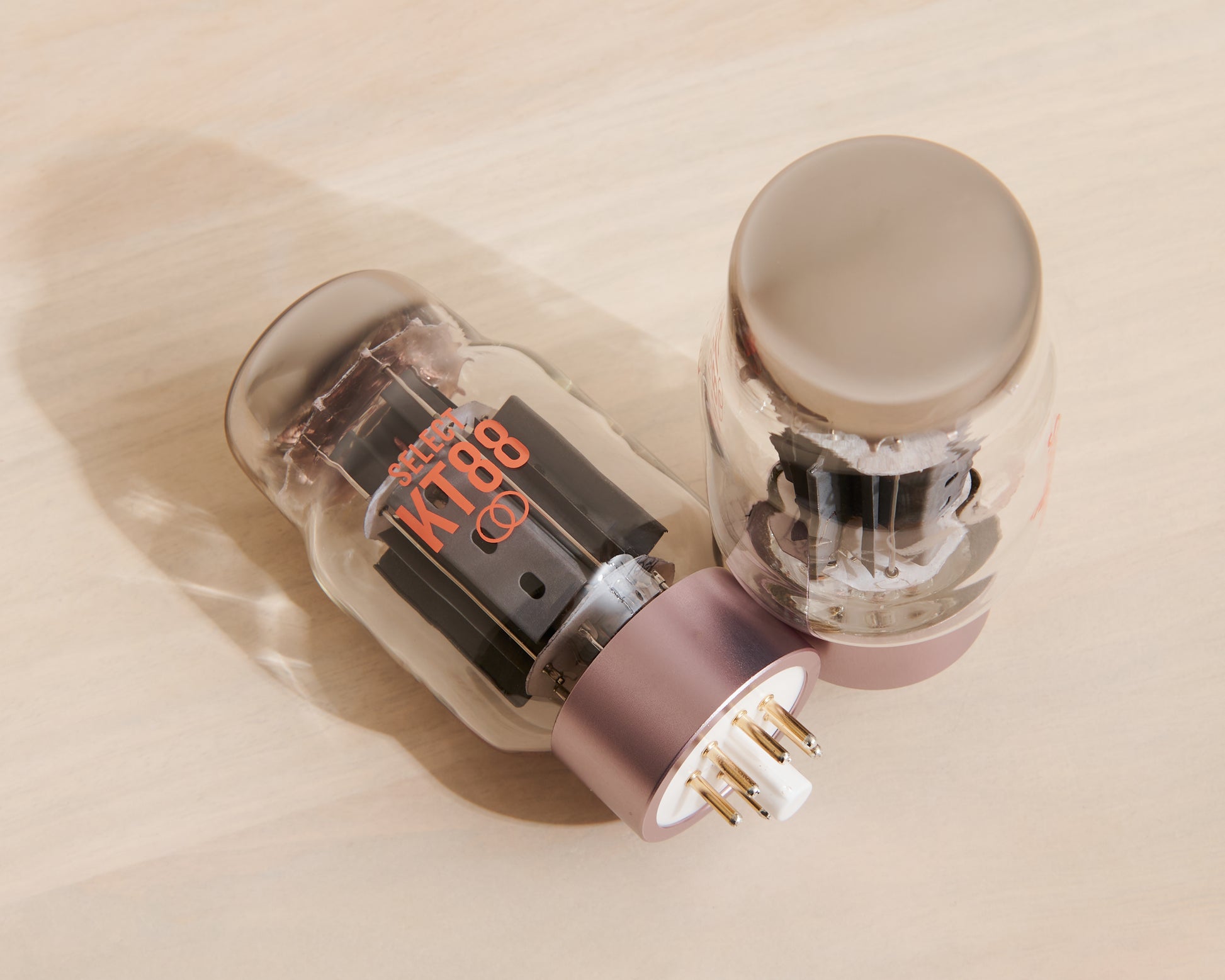 Vacuum tube amplifier on a beige surface