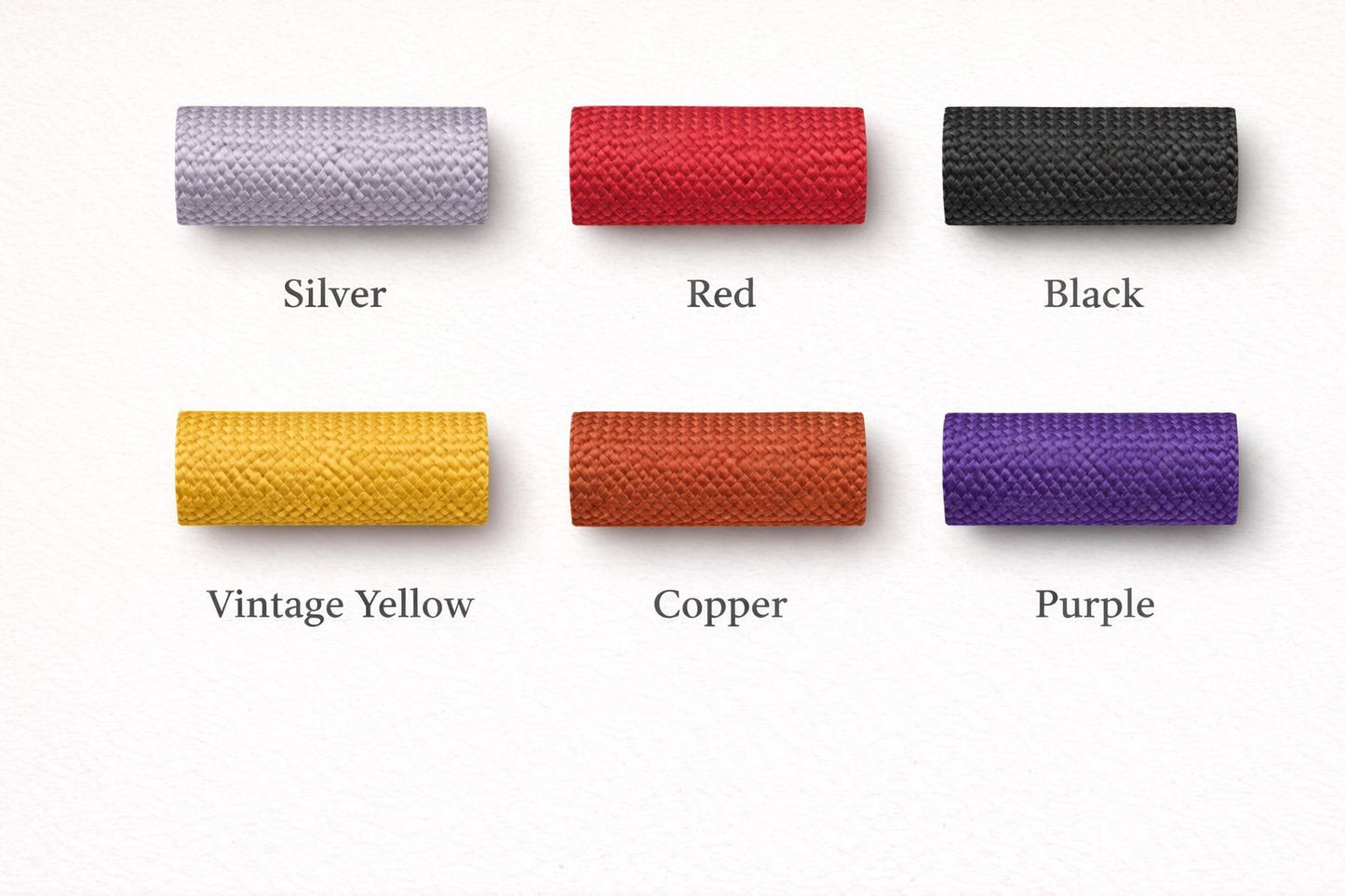 six different colored spools of cord, each with a label indicating the color: silver, red, black, vintage yellow, copper, and purple.