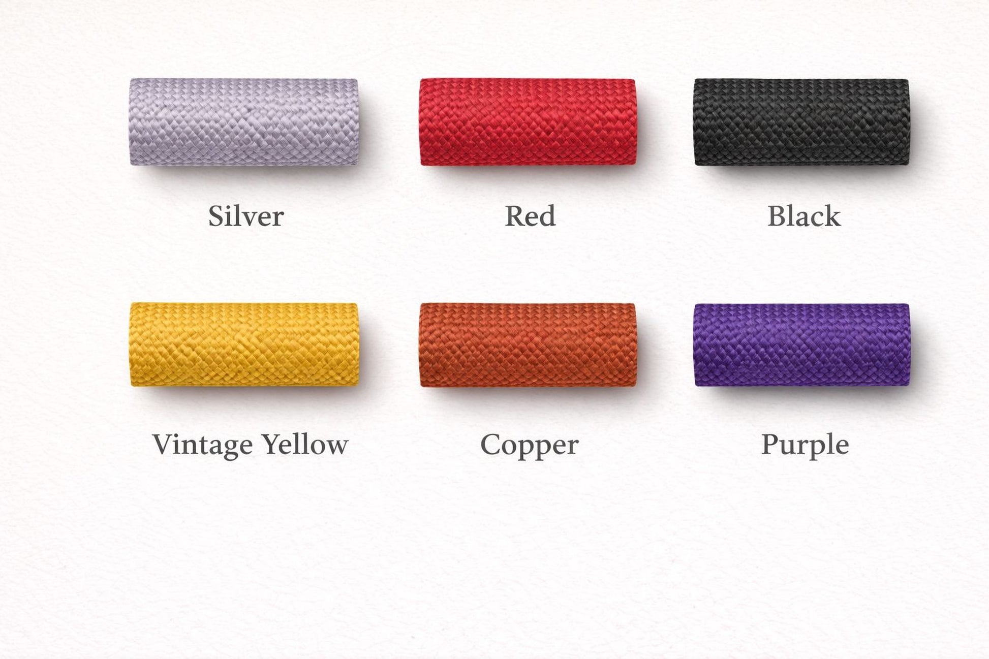 six different colored spools of cord, each with a label indicating the color: silver, red, black, vintage yellow, copper, and purple.